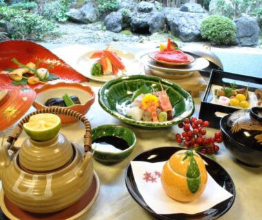 Assorted lacquerware dishes with seasonal garnishes at Nissho Besso in Kyoto, Kansai