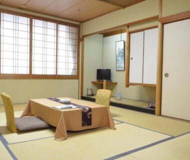 Traditional tatami room with low table and shoji screens at Nissho Besso in Kyoto, Kansai, Japan