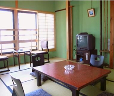 Traditional tatami room with low table, zaisu chairs and shoji screens at Nisshokan, Mie, Kansai, Japan