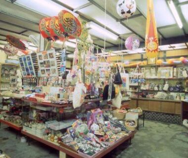 Souvenir shop with shelves of toys, lanterns, and trinkets inside Nisshokan, Mie, Kansai