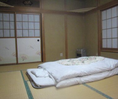 Futon on tatami mat with shoji screens and painted fusuma at Nitaya, Gunma, Japan