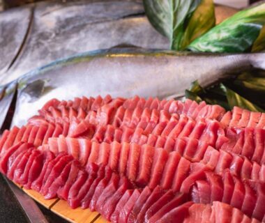 Sliced sashimi arranged on wooden board at Noboribetsu Grand Hotel Hokkaidō