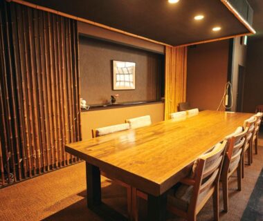 Private wooden dining room with long table and chairs at Nogami Honkan in Ōita, Kyushu