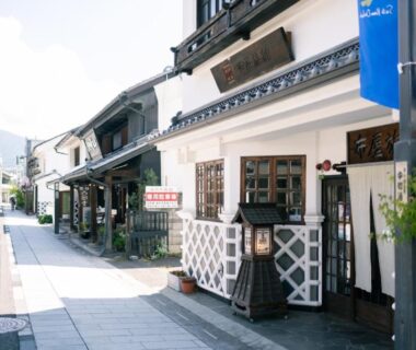 Traditional streetscape with white lattice facade and lantern, Nunoya Ryokan, Nagano