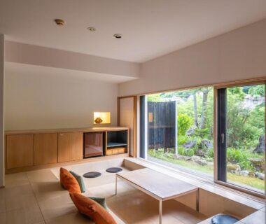 Tatami room with low table and garden view at OTARU RETREAT in Hokkaidō