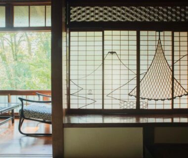 Traditional room with shoji screens, wooden seating and garden view at Ochiairo, Shizuoka