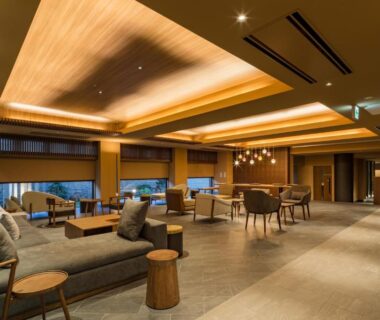 Wide lounge with wooden ceiling and seating at Oike Hotel, Yamanashi, Chūbu, Japan