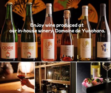 Bottles from in-house winery Domaine de Yunohara with glass and tasting counter at Oiwakeya Ryokan Nagano