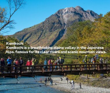 Wooden footbridge over clear river with hikers near Oiwakeya Ryokan in Nagano mountains