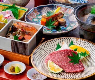 Assorted Japanese course dishes with sliced beef, appetizers and soup served at Okamotoya in Ōita, Kyushu