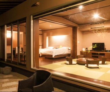 Tatami floor room with two beds and outdoor seating at Okuyado Buaiso, Ōita, Kyūshū, Japan