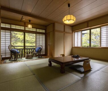 Tatami room with low table, shoji screens and window seating at Okyakuya, Kumamoto, Kyūshū, Japan