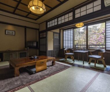 Traditional tatami room with low table and shoji screens at Okyakuya in Kumamoto, Kyūshū, Japan