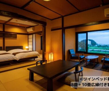 Tatami room with low table and twin beds, large window with water view at Omoideno Jinde Shizuoka