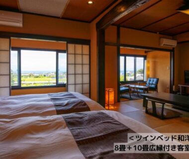 Japanese style room with tatami, twin beds, shoji screens and low table at Omoideno Jinde in Shizuoka