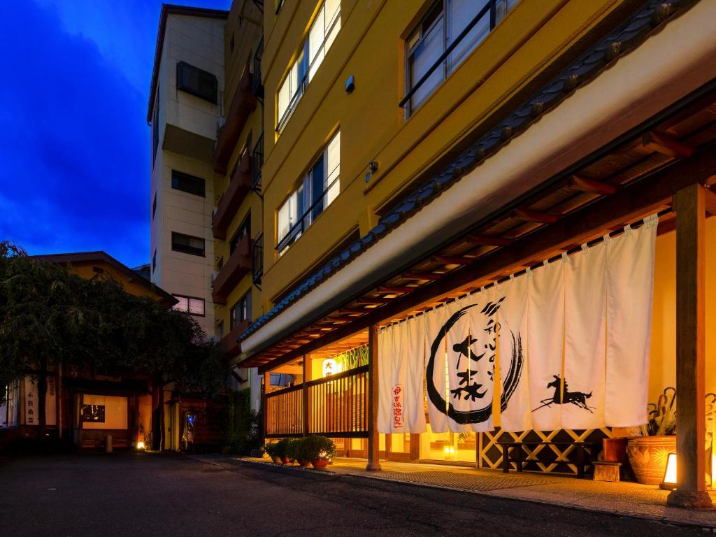Noren entrance at Omori Ryokan, Gunma Kantō Lit traditional noren curtains at Omori ryokan entrance on an evening street in Gunma, Kantō, Japan