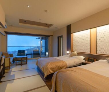 Tatami room with twin beds and balcony at Omuro no Mori Gyokusui in Shizuoka, Chūbu, Japan