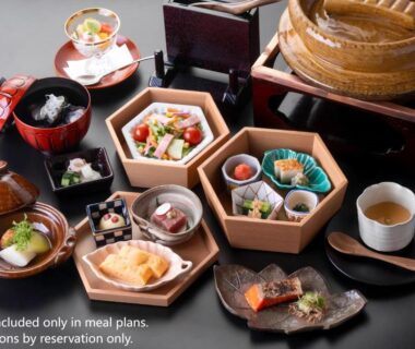 Assorted Japanese dishes in lacquerware and wooden boxes at Oni no Sumika, Shizuoka, Chūbu