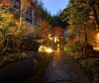 Nighttime stone walkway through landscaped garden at Oni no Sumika in Shizuoka, Chūbu, Japan
