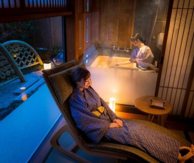 Guest in yukata seated by indoor wooden bath at Onomichi Hansei, Hiroshima, Chūgoku, Japan