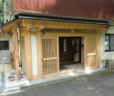 Wooden lattice doors at Onsen Minshuku Sakaeya entrance in Iwate, Tōhoku