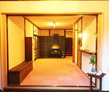 Traditional tatami room with shoji screens, low hearth and simple wooden furnishings at Onsen Yado Misuzuso in Nagano