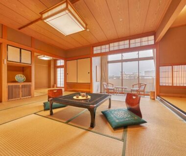 Traditional tatami room with low table at Ooedo Onsen Monogatari Awazu Grand Hotel, Ishikawa, Chūbu, Japan