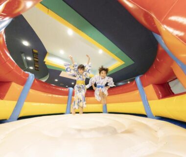 Children jumping on inflatable indoor play area at Ooedo Onsen Monogatari Awazu Grand Hotel in Ishikawa Chūbu