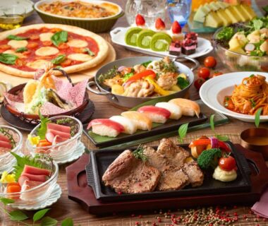 Assorted sushi, steak, pizza and desserts on buffet table at Ooedo Onsen Monogatari Gero, Gifu