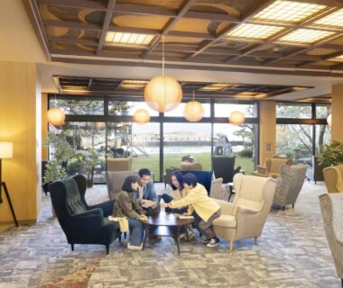 Spacious lobby lounge with armchairs and garden view at Ooedo Onsen Monogatari Premium Kaga Maruya, Ishikawa
