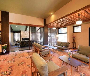 Lounge seating with low tables and lattice ceiling at Otogitei Kofu in Nagano, Chūbu region