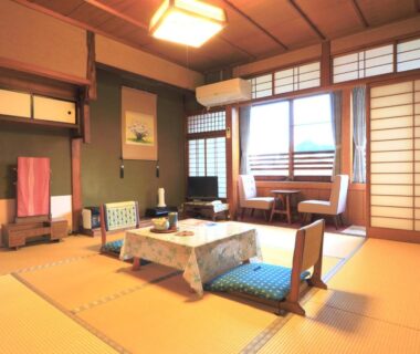 Tatami room with low table and shoji screens at Ougiya Ryokan, Hyōgo, Kansai