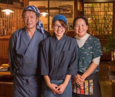 Three staff in traditional attire inside Oyado Ichifuji interior, Tochigi, Kantō