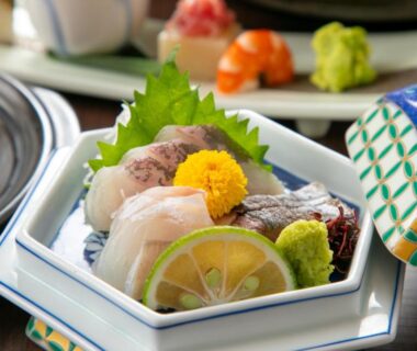 Sashimi assortment with wasabi and citrus garnish at Oyado Ichizen, Ōita, Kyūshū, Japan