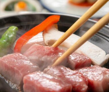 Seared beef cubes on a tabletop grill at Oyado Ichizen in Ōita, Kyūshū