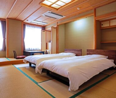Tatami floor room with two beds at Oyado Kinkiyu Annex SUIKAZURA in Hokkaidō