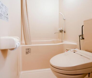 Compact bathtub and toilet unit with shower, simple bathroom layout at Oyado Kinkiyu Annex SUIKAZURA Hokkaidō