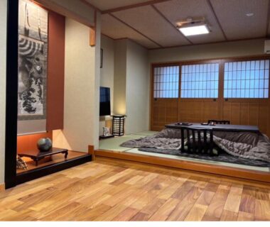 Raised tatami area with kotatsu and shoji screens at Oyado Koto No Yume in Gifu, Chūbu, Japan