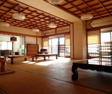 Tatami room with low wooden tables and shoji screens at Oyado Matsubaya, Gunma, Kantō