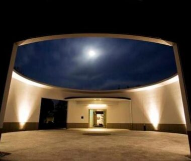 Moonlit circular oculus and entrance of Oyado The Earth courtyard in Mie at night