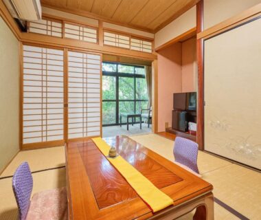 Tatami room with low table and shoji screens at Oyado Yumechidori in Saga, Kyushu