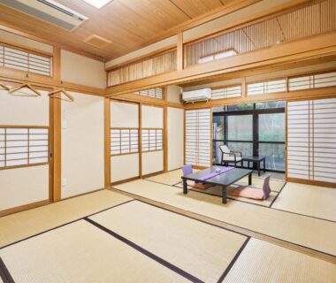 Traditional tatami room with low table, shoji screens and balcony seating at Oyado Yumechidori in Saga, Kyushu