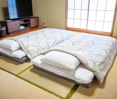 Futon bedding on tatami beside shoji screens at PiDDs Family 熱海 in Shizuoka