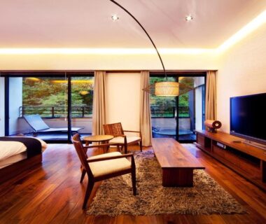 Low seating, bed area and sliding glass doors at Hanare Matsushimakaku in Fukushima, Tohoku