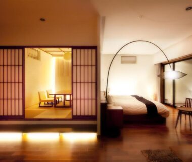Tatami seating area and western bed in Hanare Matsushimakaku suite, Fukushima Tōhoku