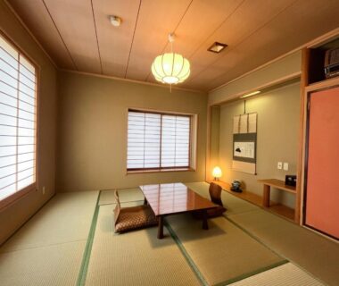 Tatami room with low table and shoji screens at Renovated room Japanese inn Matsumoto, Iwate, Japan