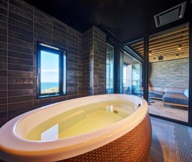 Oval indoor soaking tub with terrace seating at Resort Hills Toyohama Soranokaze, Mie, Kansai