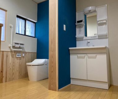 Compact bathroom with modern Japanese toilet and vanity at Riverside Hotel Karatsu Castle in Saga, Kyushu