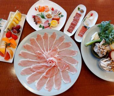 Thinly sliced meat platter, assorted vegetables, sashimi and desserts arranged for hot pot dining at Rokumeikan Hills, Yamanashi