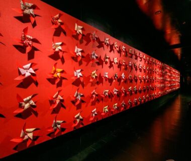 Red corridor lined with origami decorations at Rurikoh in Chubu, Ishikawa, Japan